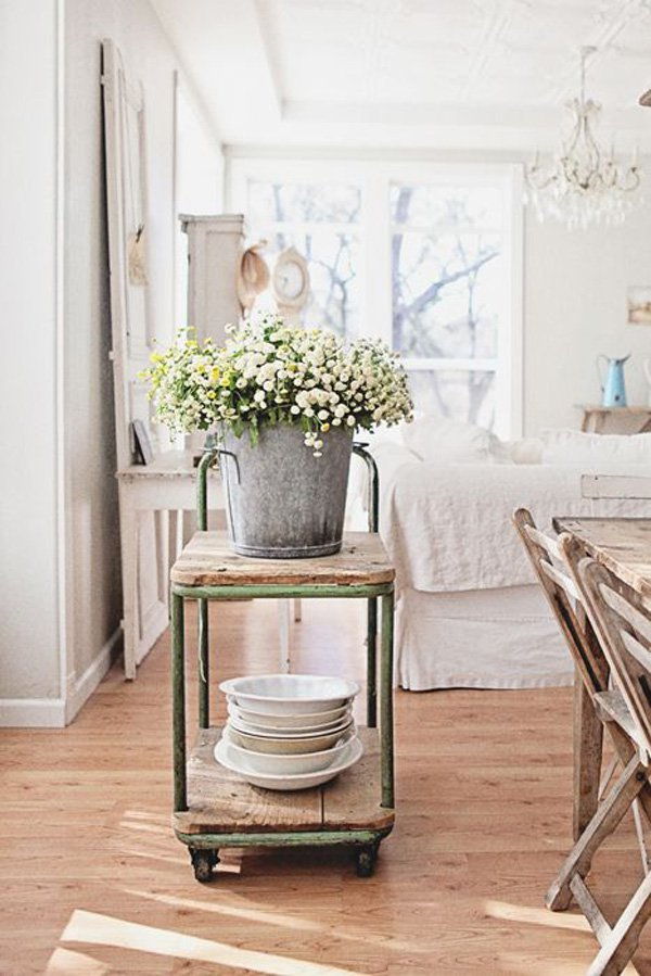 Bájos antique cart with a bucket of flowers