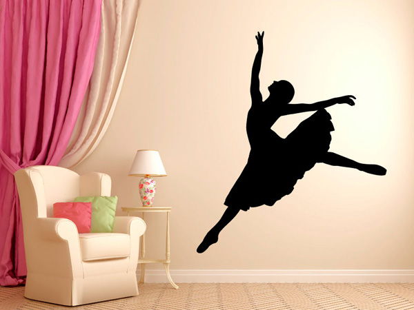 The silhouette of dancing ballerina wall decal, along with the massive pink curtains, transforms the wall to a stage and the living room to a theater