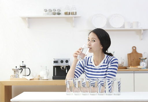 Azije woman drinking water